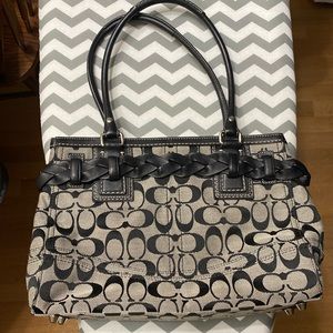 Coach brand black and grey  purse with wrap around  belt with tassel.